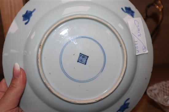 An 18th century Kangxi Chinese blue and white dragon plate and one other. largest diameter 22.5cm